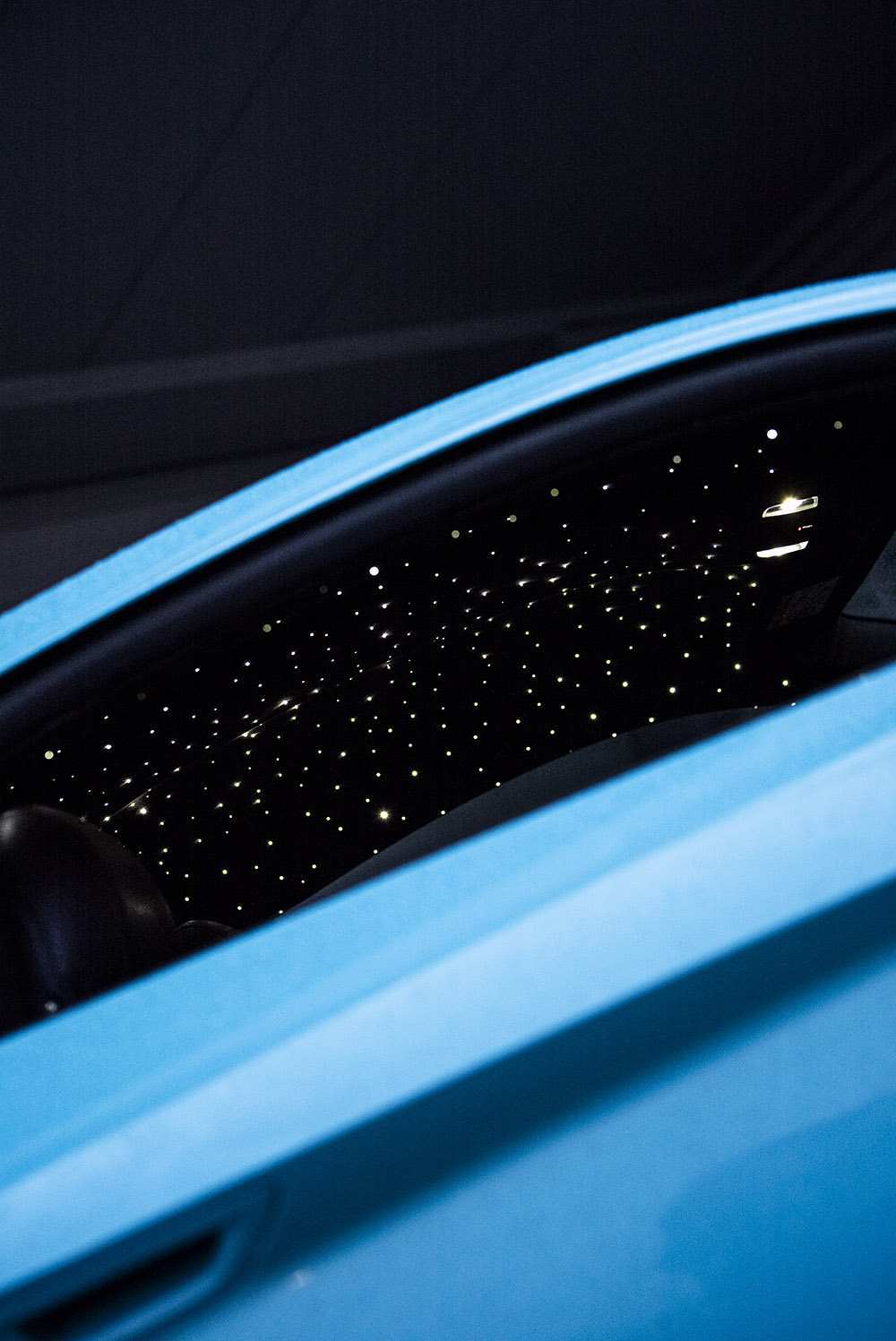 starlight headliner on a blue car interior