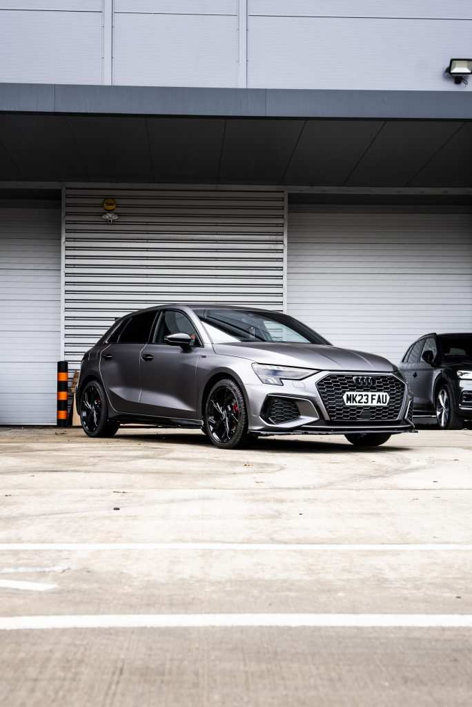 Audi A3 full view in front of Garage