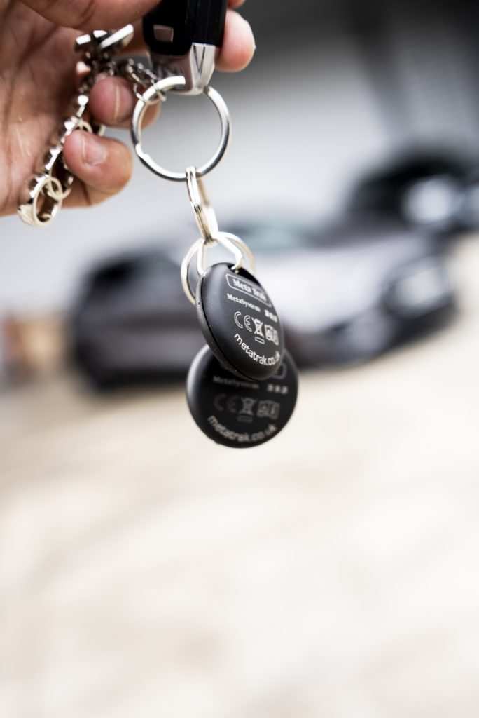 man holding key chain