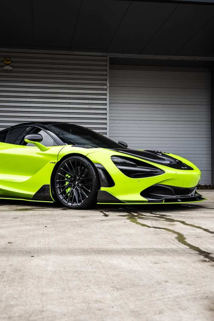 Green car wrapped sports vehicle with green caliper paint and black accents